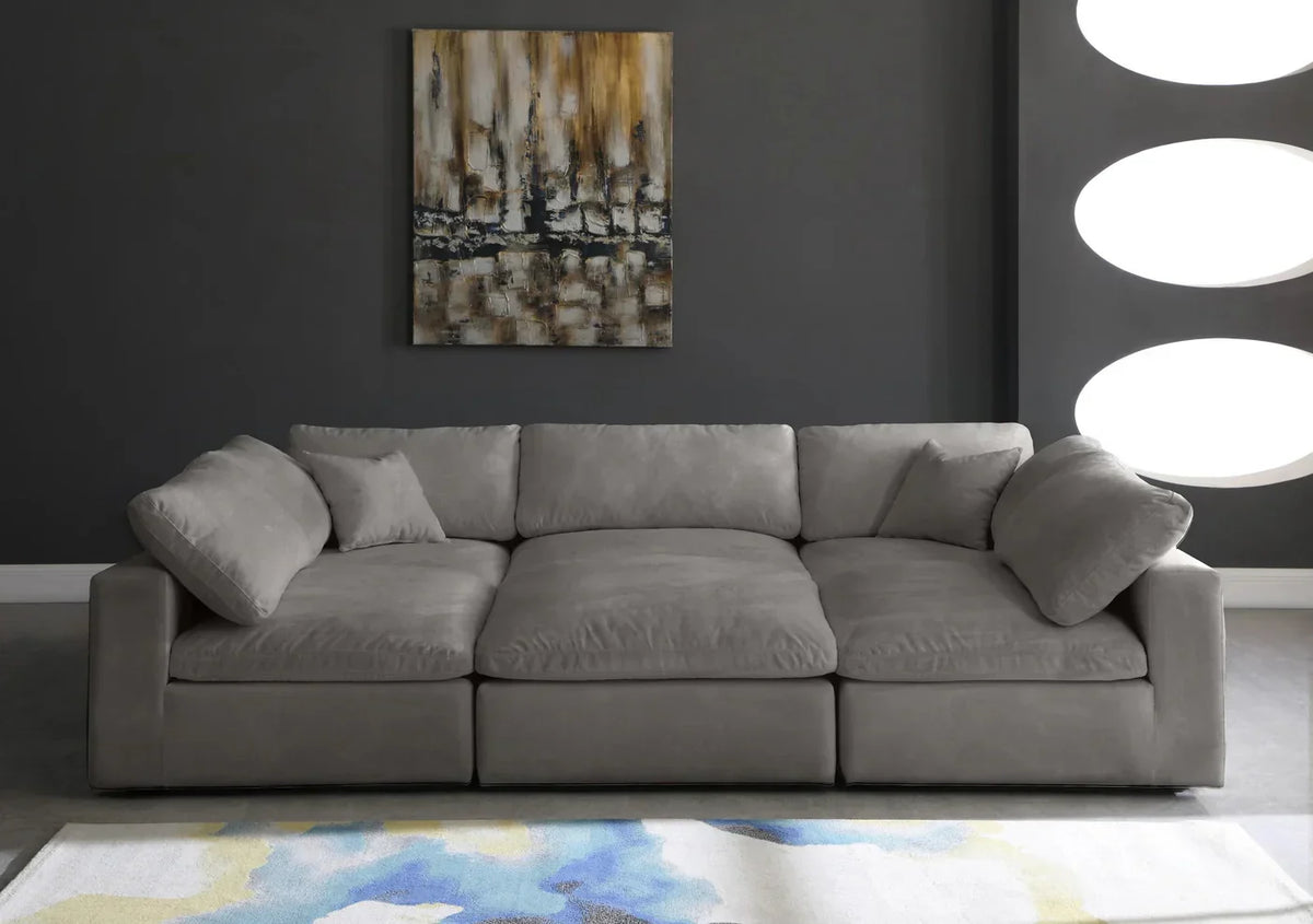 Modern grey fabric cinema couch with cushions in a contemporary living room