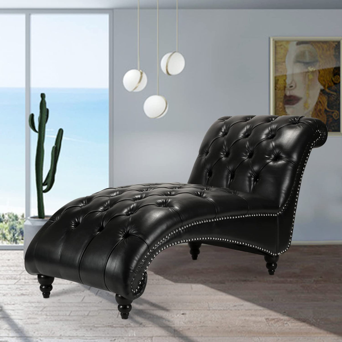 Luxurious black leather tufted chaise lounge with silver nailhead trim in a modern room