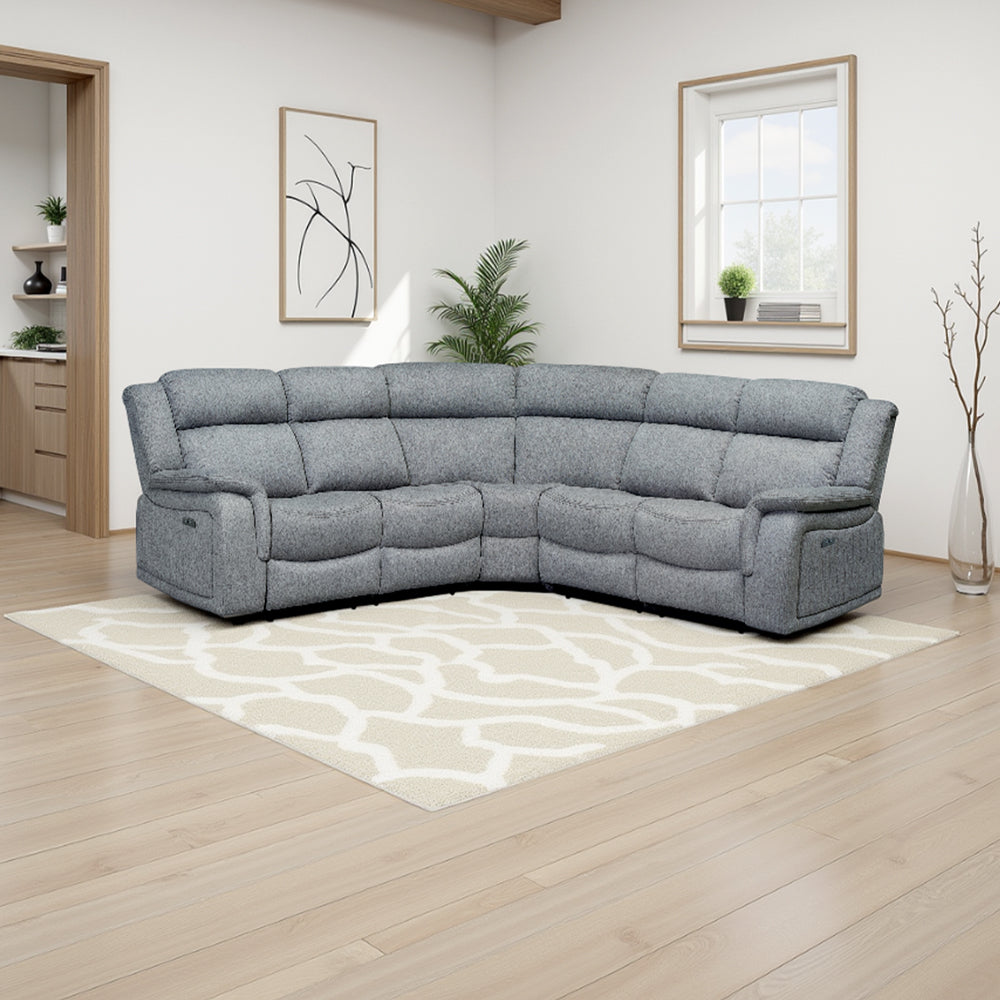 Grey fabric curved electric recliner sofa in a modern living room with a cream rug