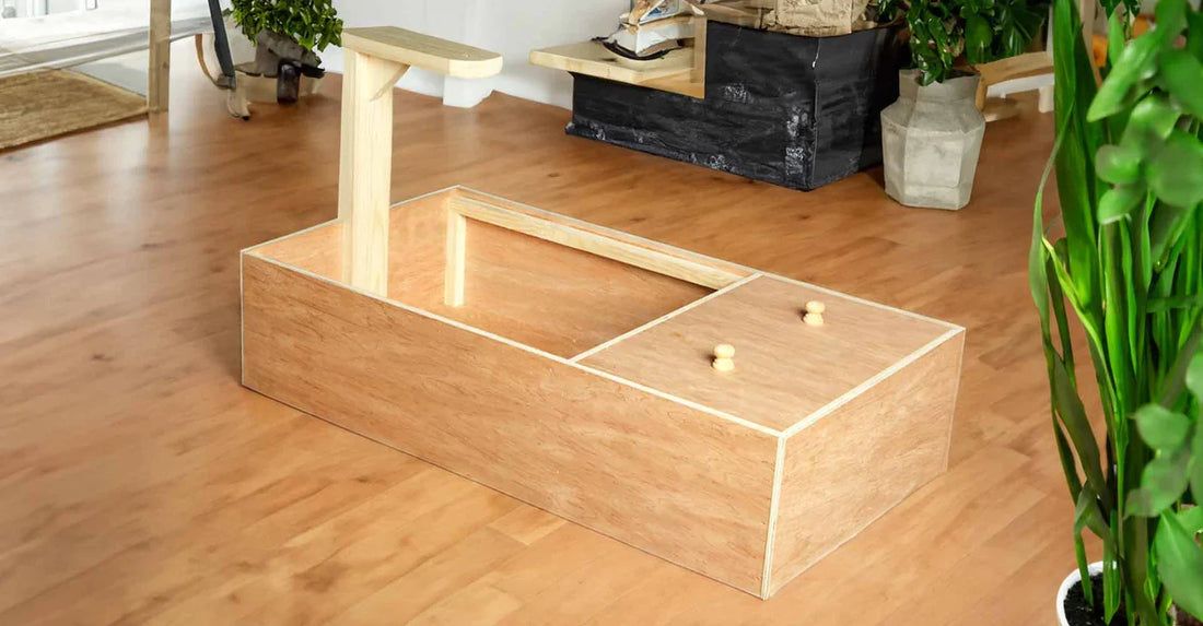 Handcrafted wooden tortoise table with integrated lamp stand on a light wood floor